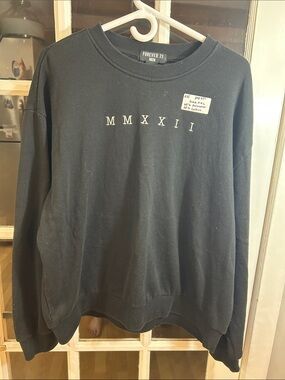 A55.    Forever 21 Men Black MMXXII Crewneck Sweatshirt - Minimal Roman Numeral